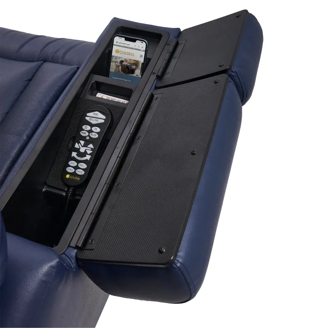 Power lift recliner armrest storage compartment open, holding a remote control and smartphone, blue upholstery