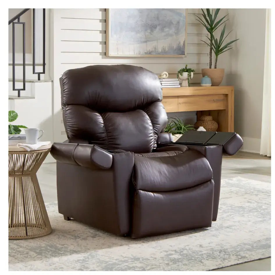Power lift recliner in dark brown faux leather with tufted back and side control panel, shown in a home living room setting