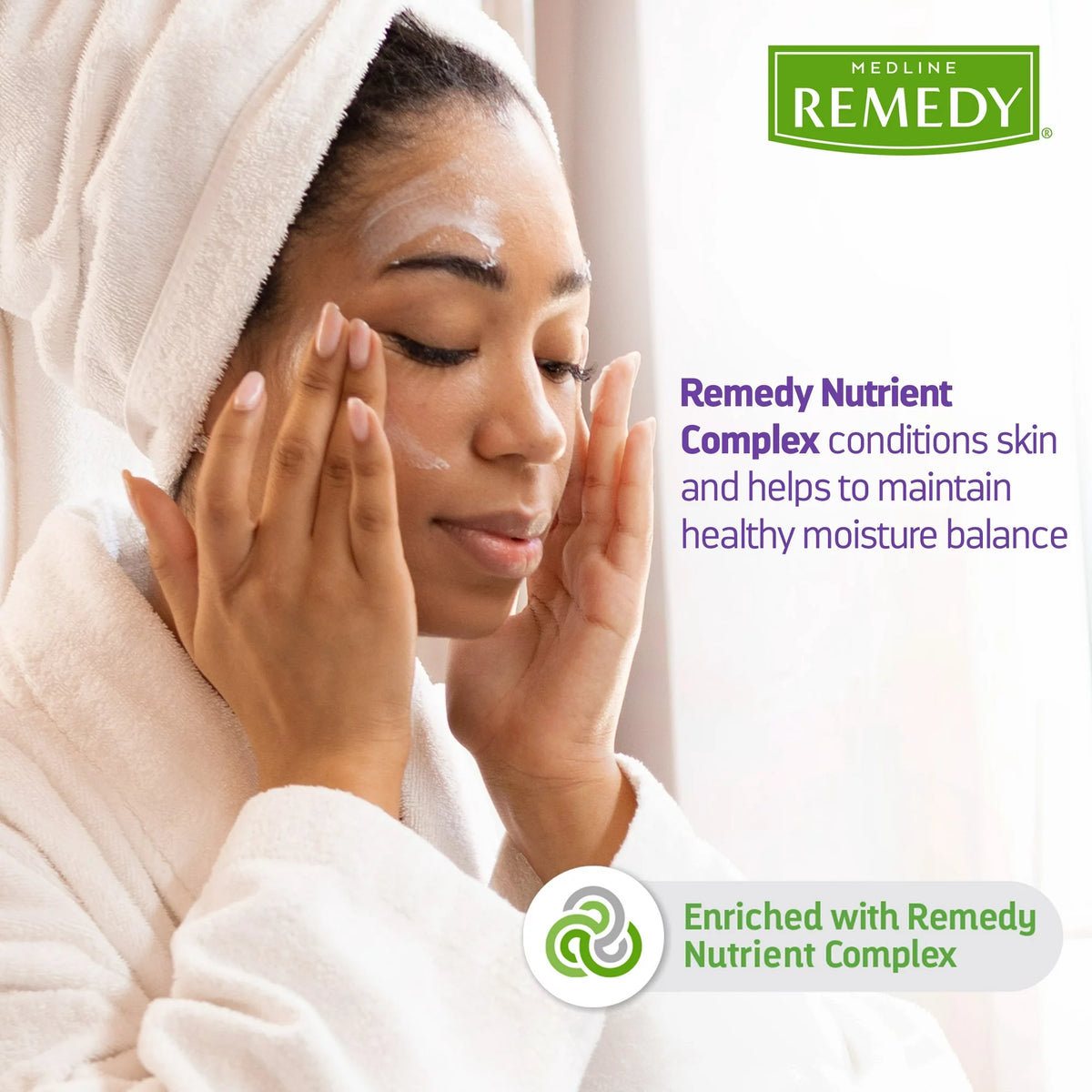 Medline Remedy skin cream shown being applied to a woman's face while wearing a white robe and towel wrap