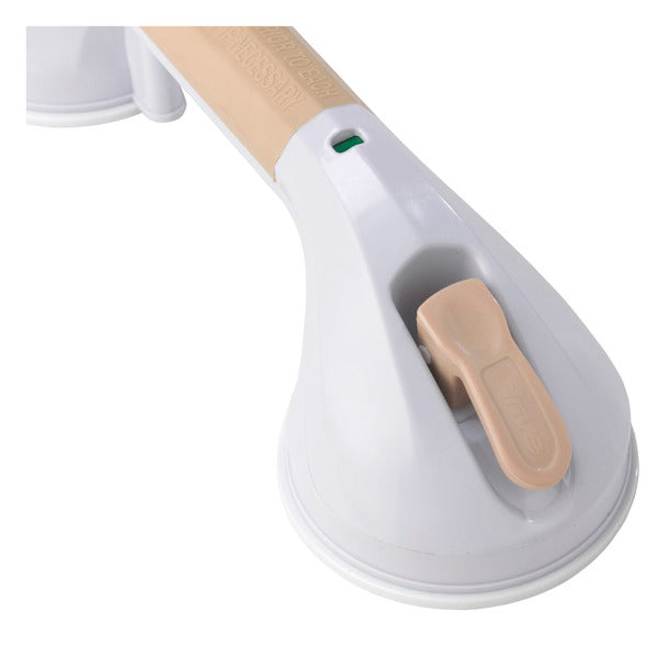 Suction cup grab bar close-up showing white base with beige locking lever and green safety indicator light