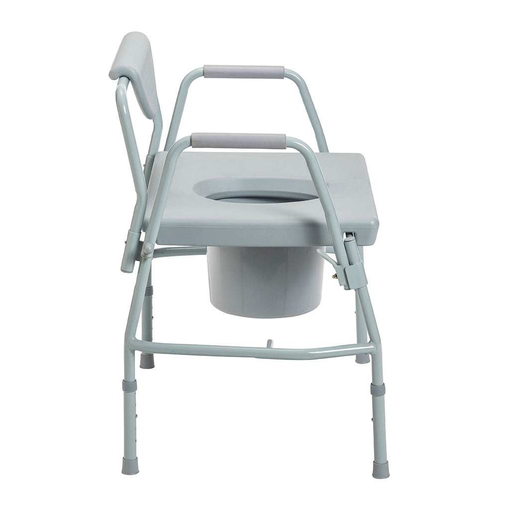 Bariatric drop-arm commode with gray steel frame, padded armrests, open seat, removable bucket, and adjustable legs, side