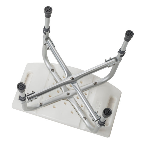 Shower chair with white molded plastic seat and silver aluminum cross-frame brace, viewed from below showing rubber-tipped