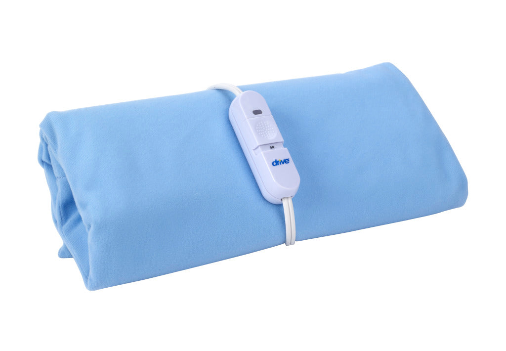 Moist-dry heating pad folded in light blue fabric with attached white corded controller on white background