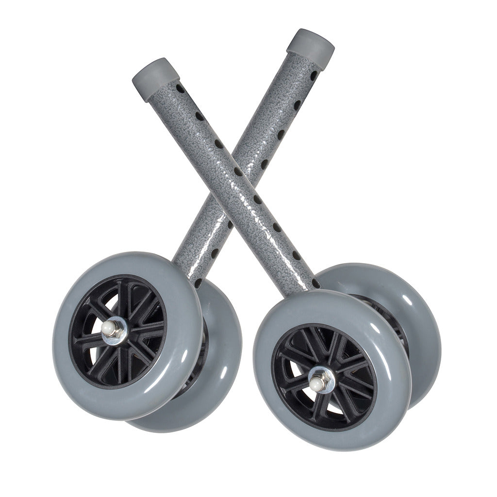 Walker wheels with gray rubber tires and black spoke hubs on adjustable metal legs, shown as a pair crossed on white