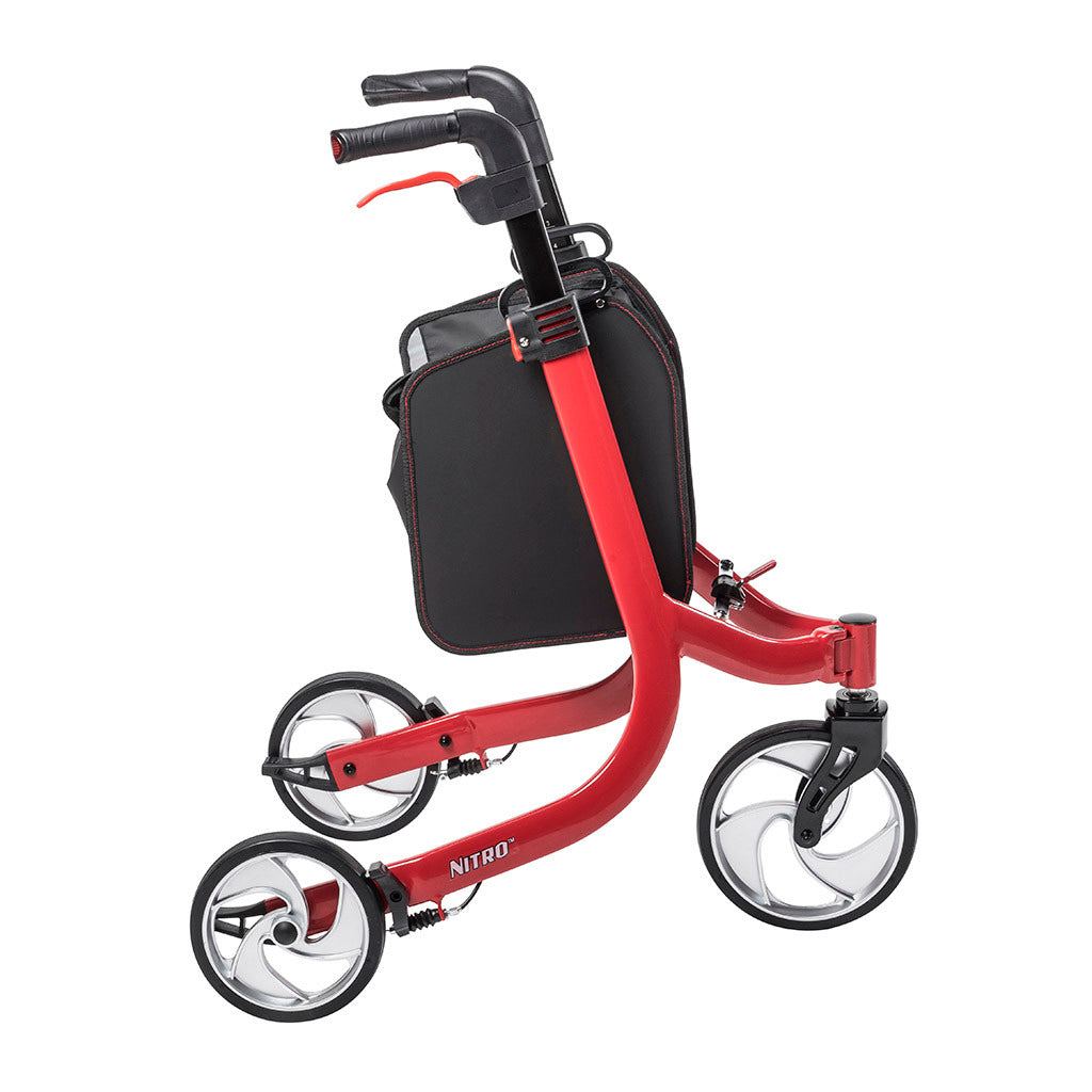 3-wheel rollator in red with black loop hand brakes, large spoke wheels, and an attached black zip-close bag
