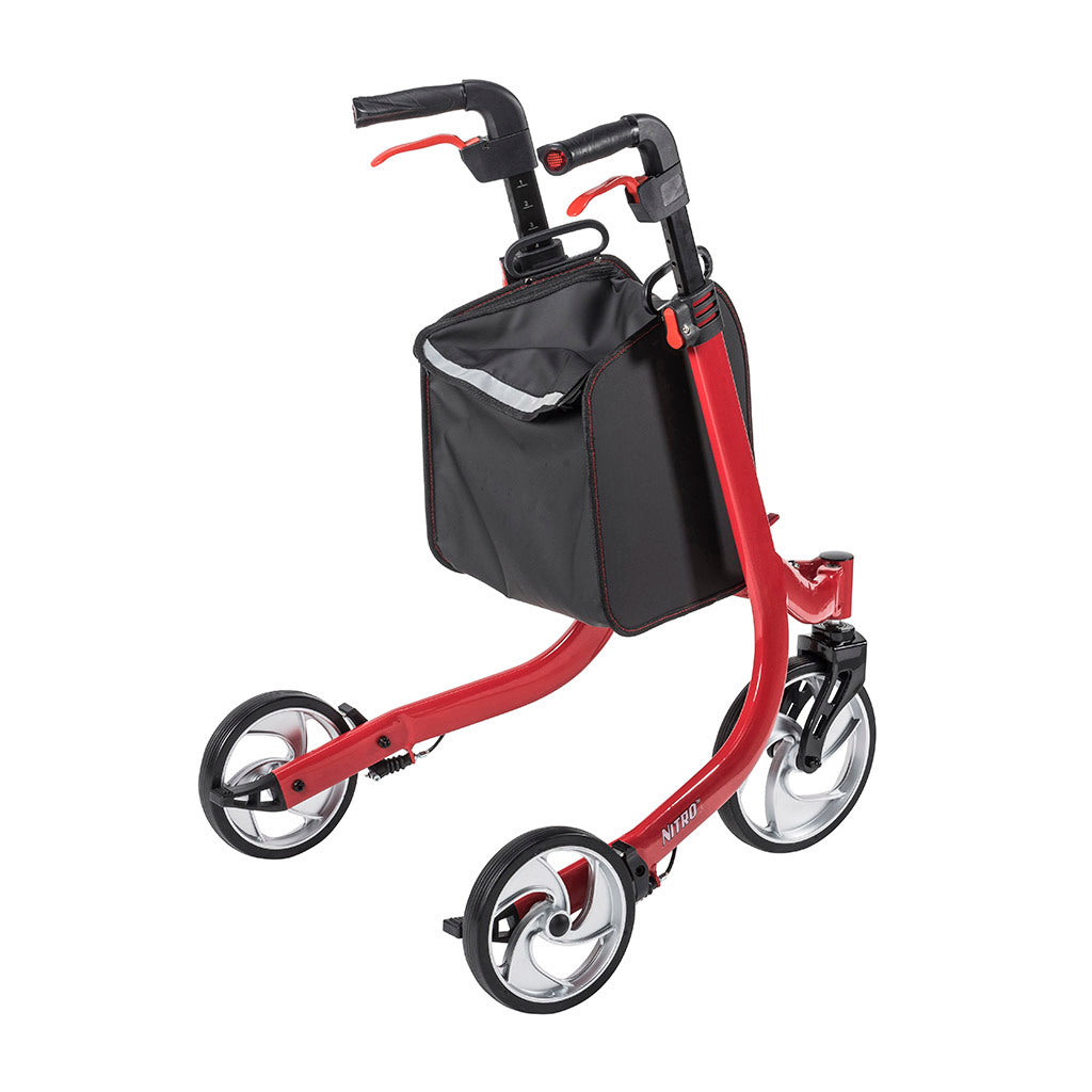 Three-wheel rollator in red with loop hand brakes, black padded handles, large spoke wheels, and a black front storage bag