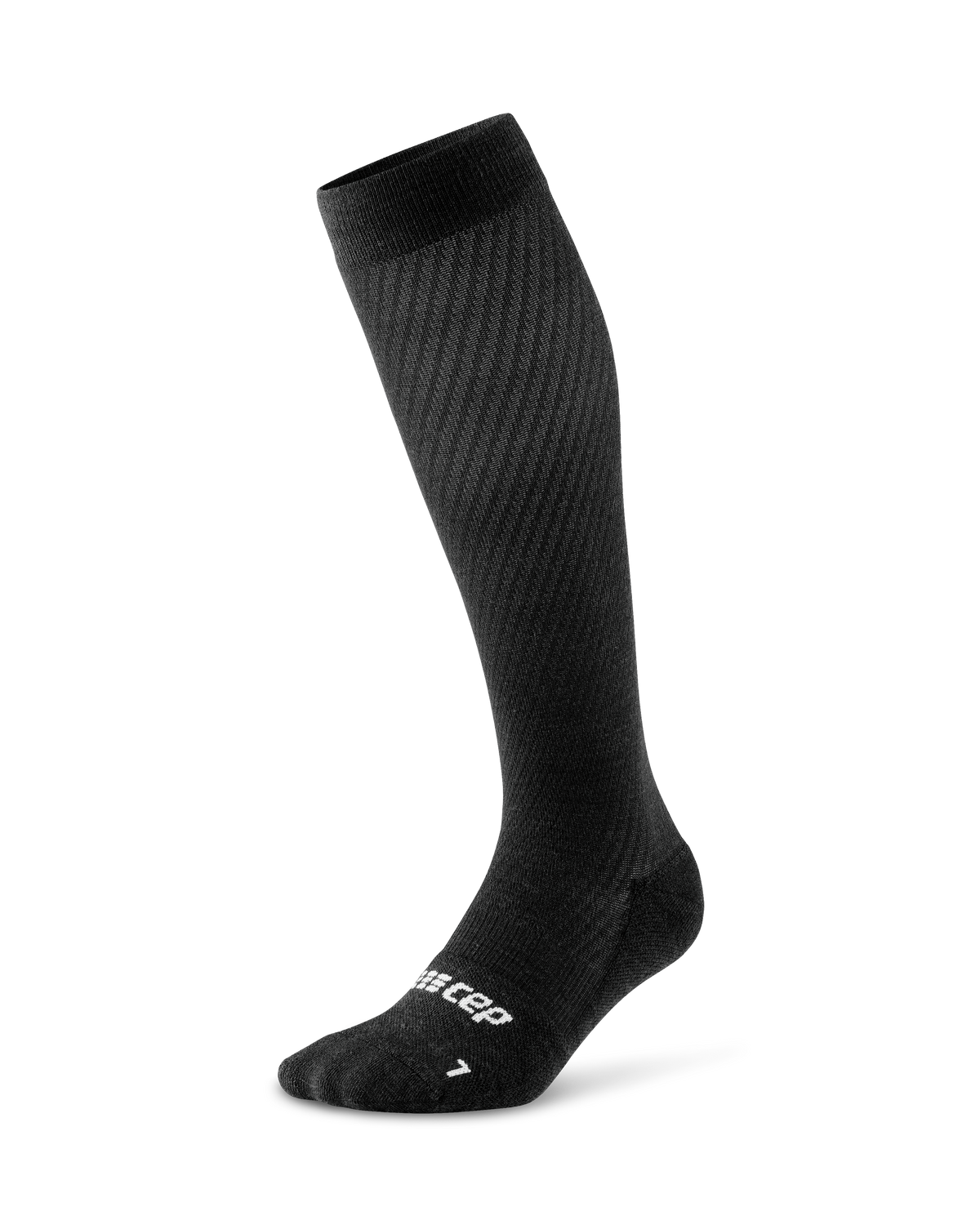 Compression flight sock in black with ribbed texture, knee-high length, and reinforced heel and toe