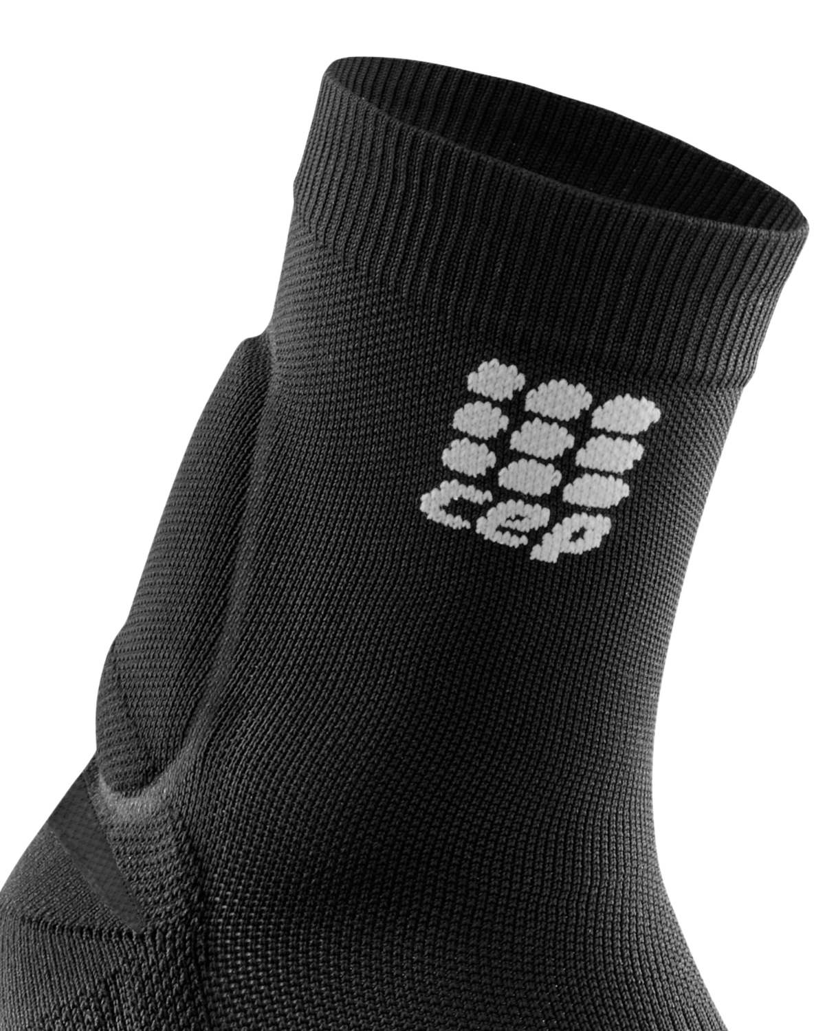 Compression sock with built-in Achilles support in black knit fabric with CEP logo, shown as close-up ankle view