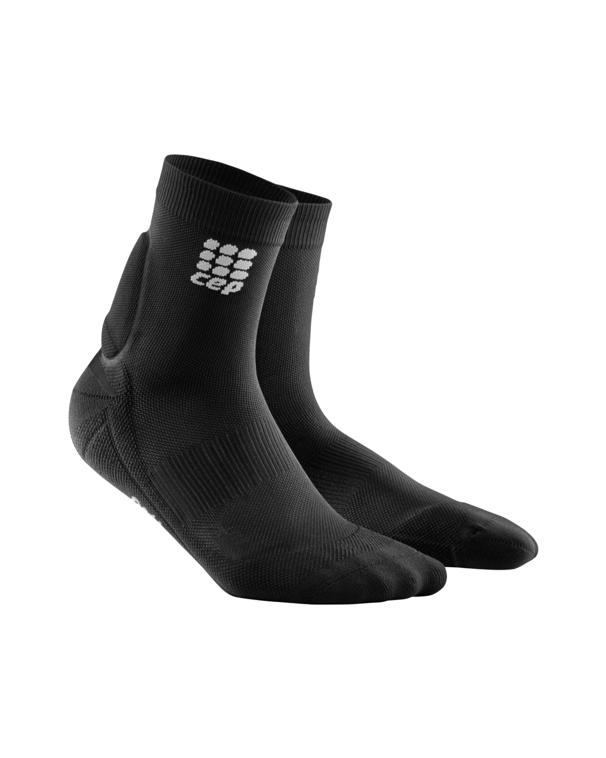 Achilles support compression socks in black with ankle stabilization panel and gray logo, ankle-height, shown as a pair