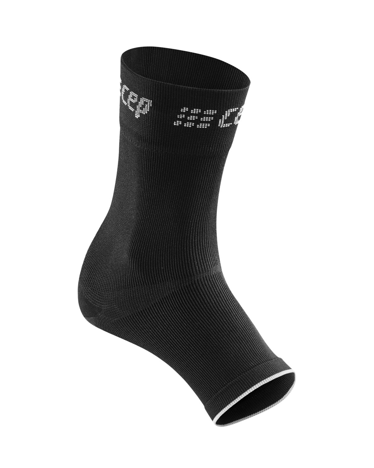 Compression ankle sleeve in black knit fabric with open toe and heel design, shown at an angle on white background
