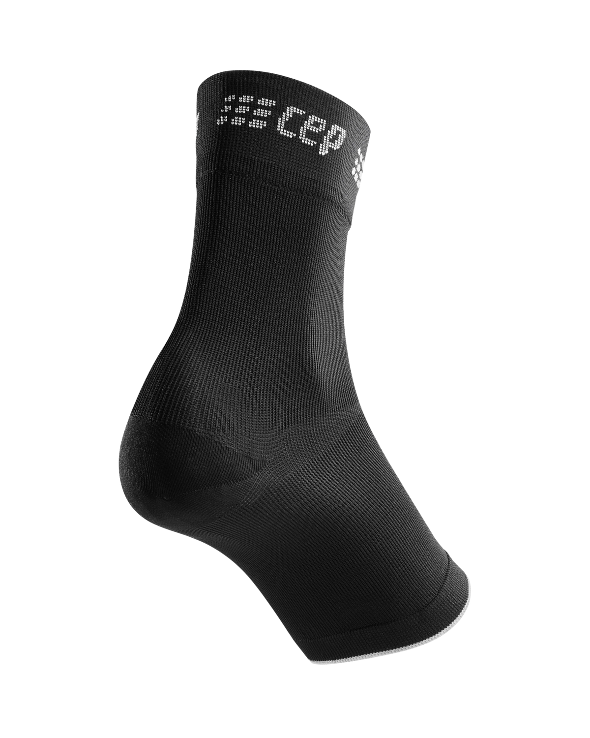 Compression ankle sleeve in black with white logo text, shown on a foot form against a white background