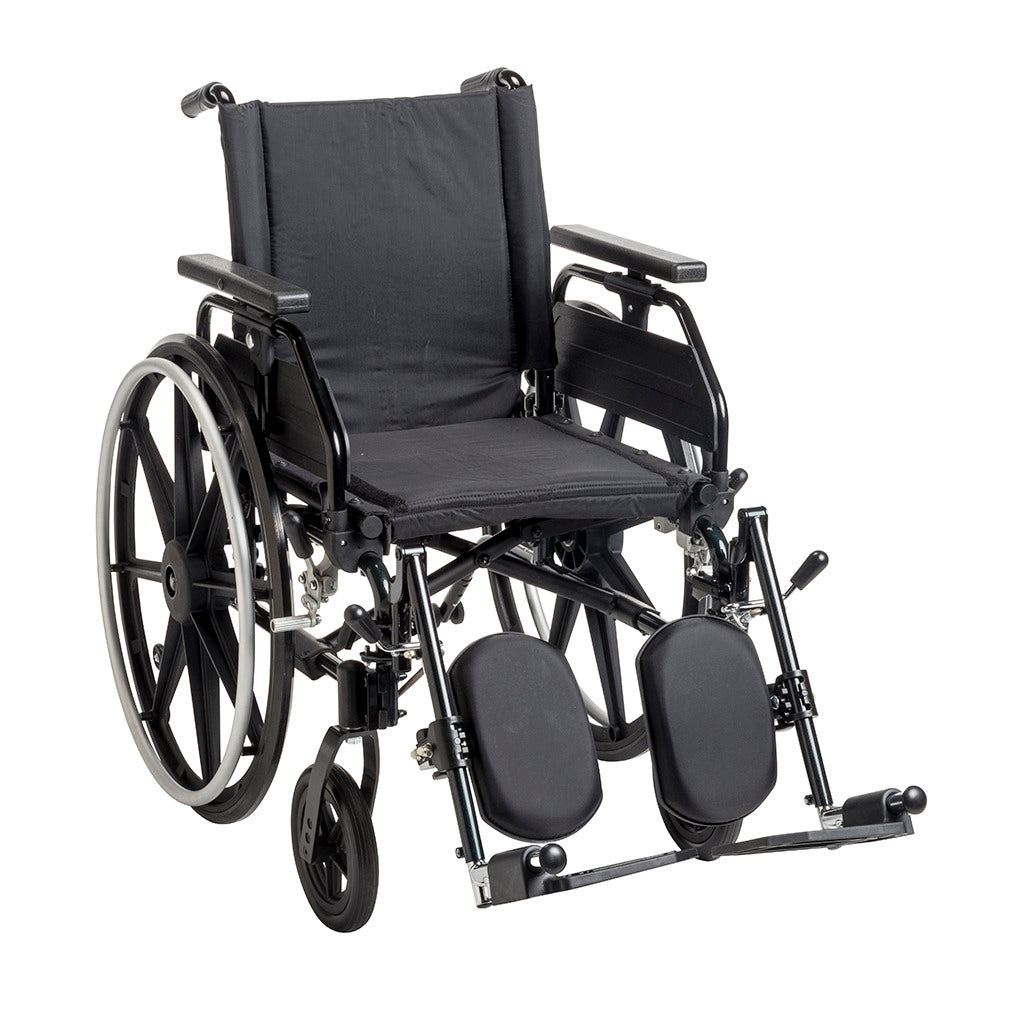 Wheelchair with black frame, padded seat and back, flip-back armrests, and elevating leg rests on white background