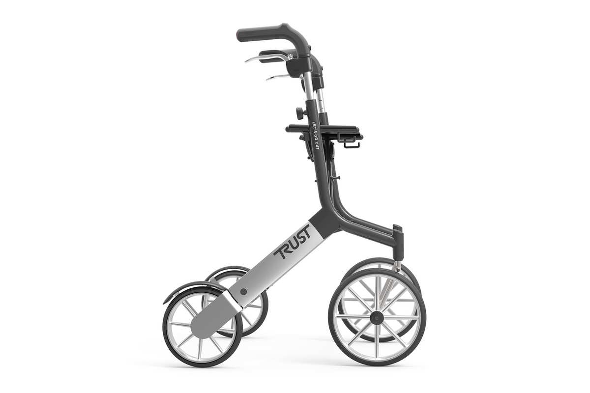 Rollator walker with black frame, ergonomic handles, hand brakes, and large spoked wheels, shown from the side on white