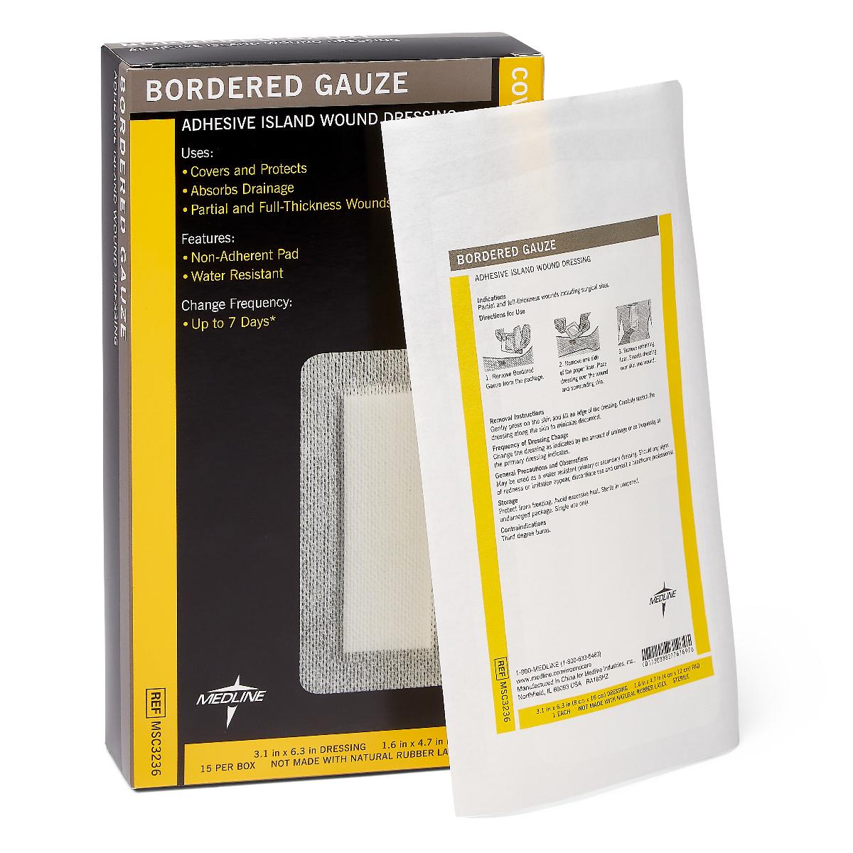 Bordered gauze adhesive island wound dressing box of 15 with single sterile packaged dressing leaning against it