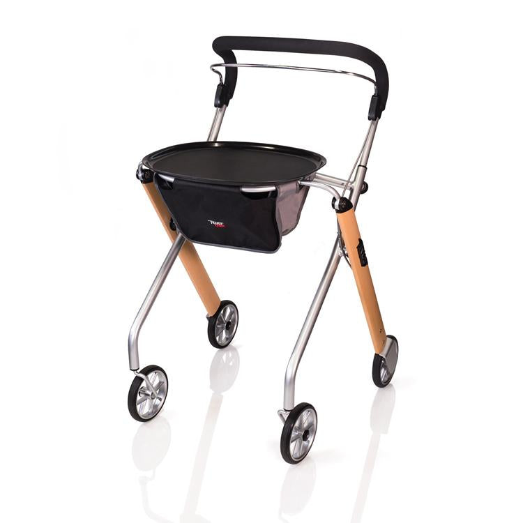 Rollator walker with narrow silver and wood-tone frame, black padded handle, tray, storage bag, and four wheels