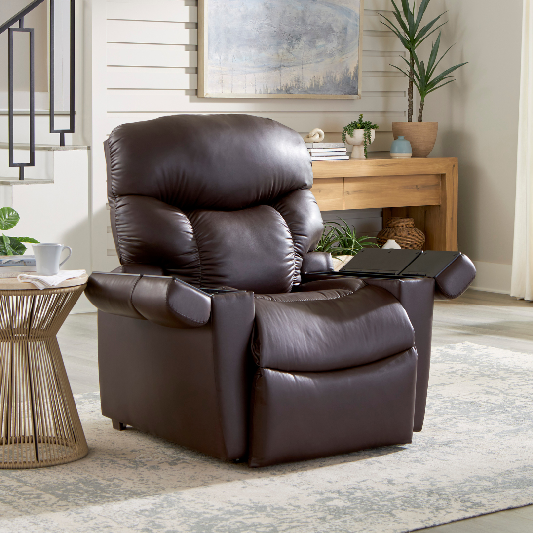 Power lift recliner in dark brown leather upholstery with tufted back cushion and fold-out tray table, shown in a living