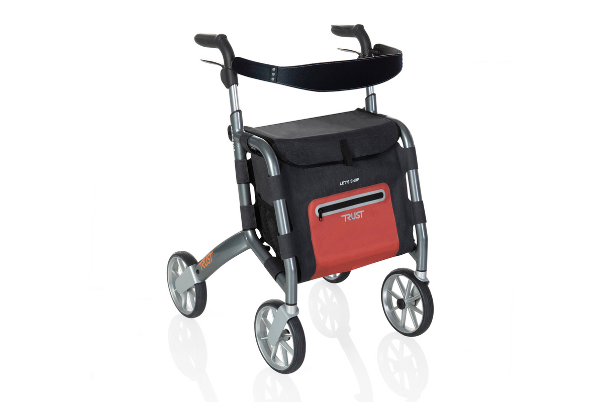 Rollator walker with four wheels, padded forearm support, black storage bag, and red front pocket on a silver frame