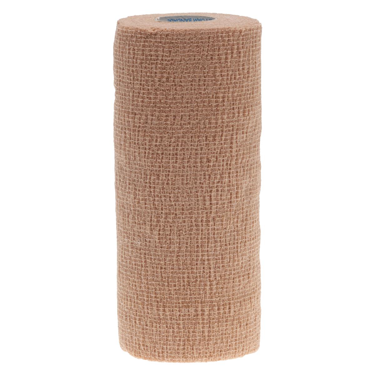 Cohesive foam bandage roll in tan with a textured woven surface, standing upright on a white background