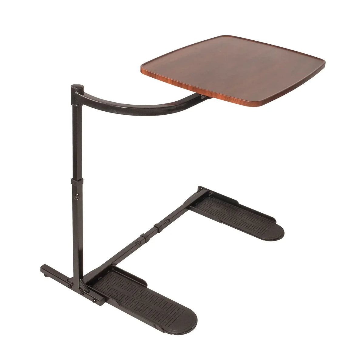 Overbed tray table with walnut-finish top, curved black metal arm, adjustable upright post, and two textured foot platform
