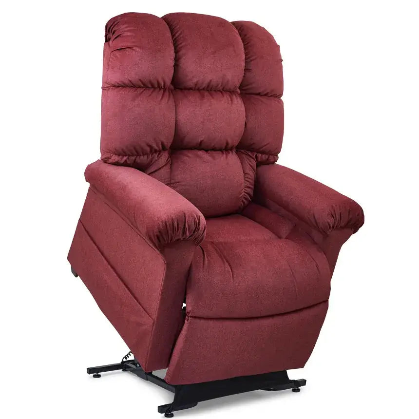 Lift chair recliner in deep red fabric with tufted pillow-back cushioning, padded armrests, and black metal base frame