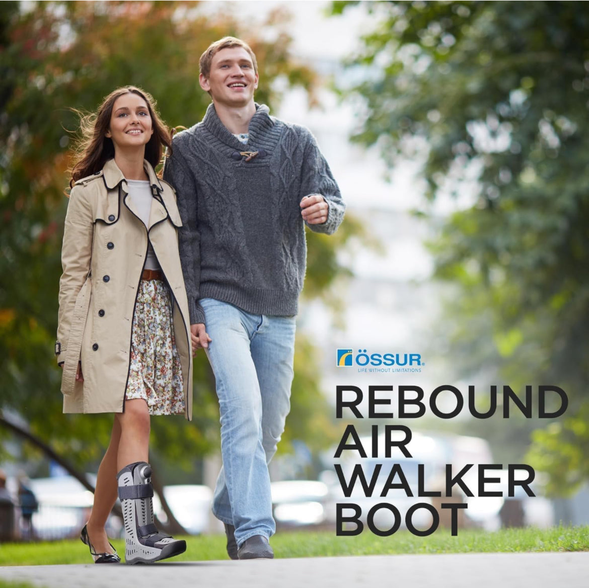 Ossur Rebound Air Walker boot worn by a woman walking outdoors with a companion on a tree-lined path