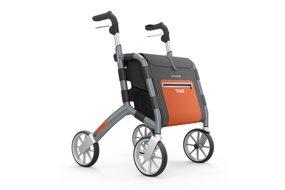 Rollator walker with four large wheels, gray aluminum frame, ergonomic handles, and an attached orange and gray shopping bag