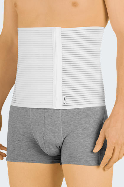 Abdominal binder in white with horizontal ribbed texture worn around the midsection over gray boxer briefs