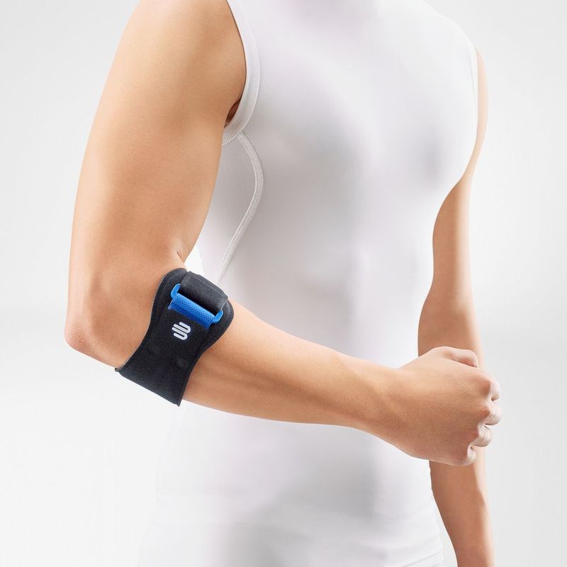 Elbow strap in black neoprene with blue pressure pad worn on a bent arm, shown against a light background