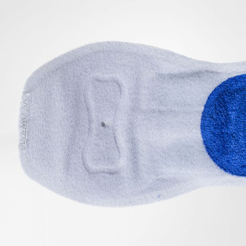 Elbow strap soft fabric interior pad with blue textured pressure insert, viewed from the back side on white background