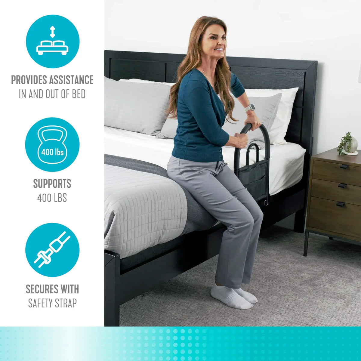 Bed rail with padded handle and storage pouch attached to a dark wood bed frame, used by a woman to assist standing up
