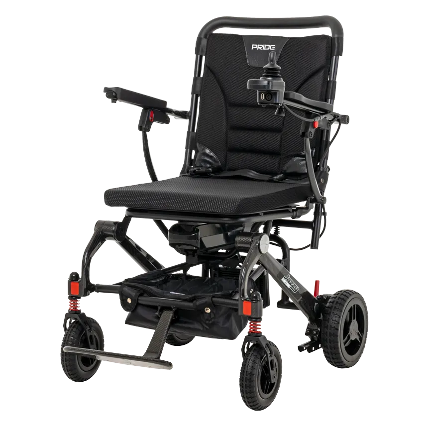 Pride Jazzy Carbon portable power wheelchair in black with joystick control, red suspension springs, and all-terrain wheels