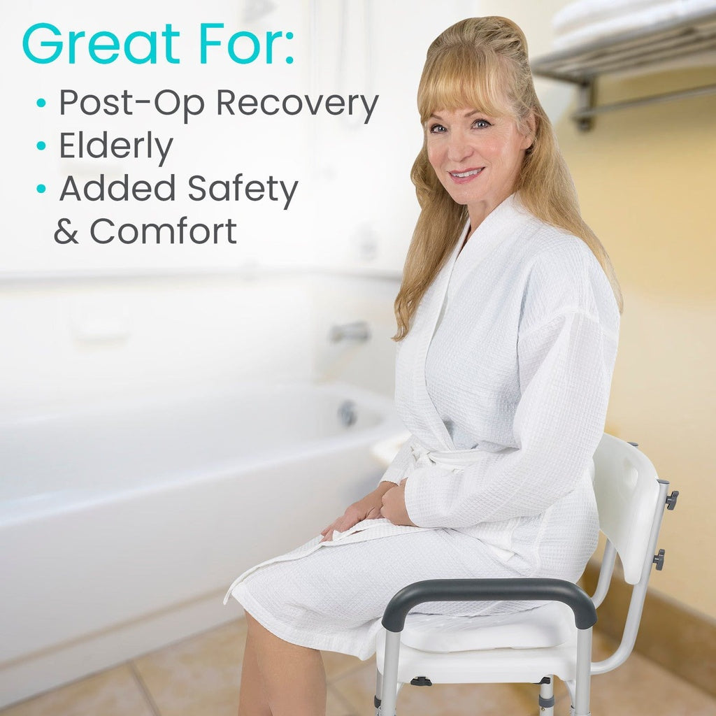 Shower seat cushion shown with a woman in a white robe seated on a bath chair with armrests beside a bathtub