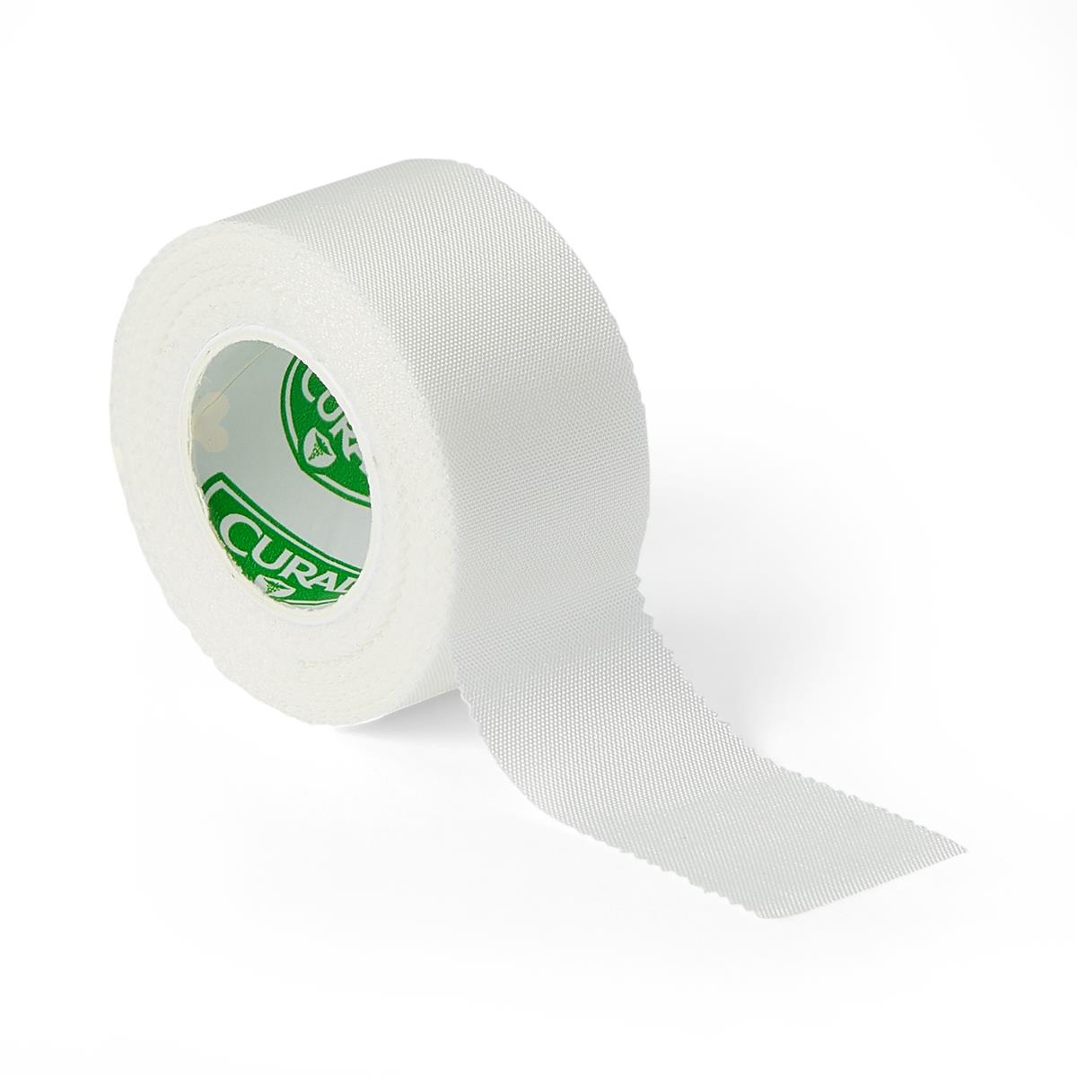 Medical cloth tape roll in white with green branded core label, shown unrolled slightly on white background