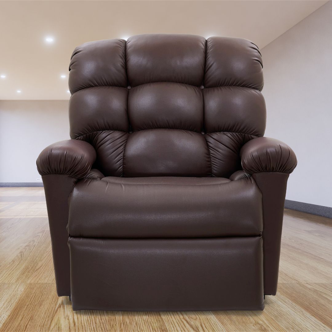 Lift chair with wide seat, tufted cloud-style backrest, rolled armrests, and upholstered in dark brown leather-like fabric