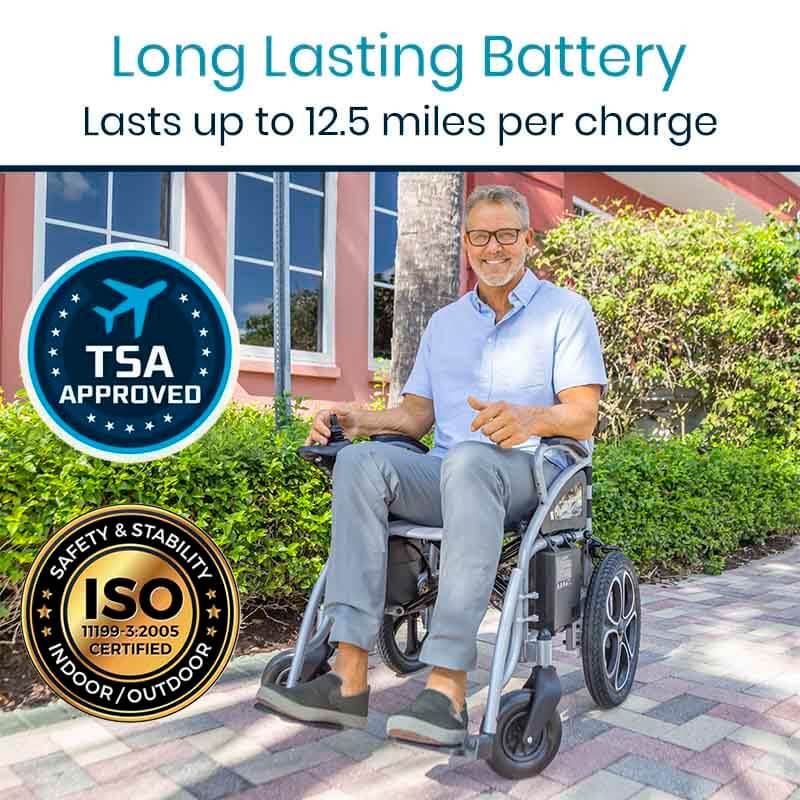 Vive Compact Power Wheelchair shown outdoors on brick path with smiling older man seated, featuring joystick control and