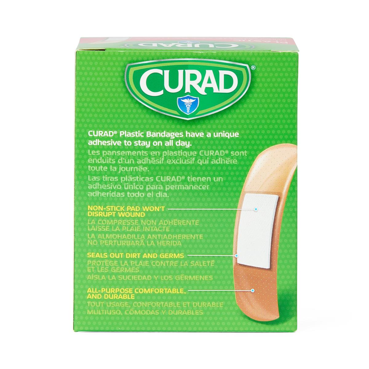 Curad plastic adhesive bandage box, green packaging showing a tan strip bandage with white non-stick pad, 100 count