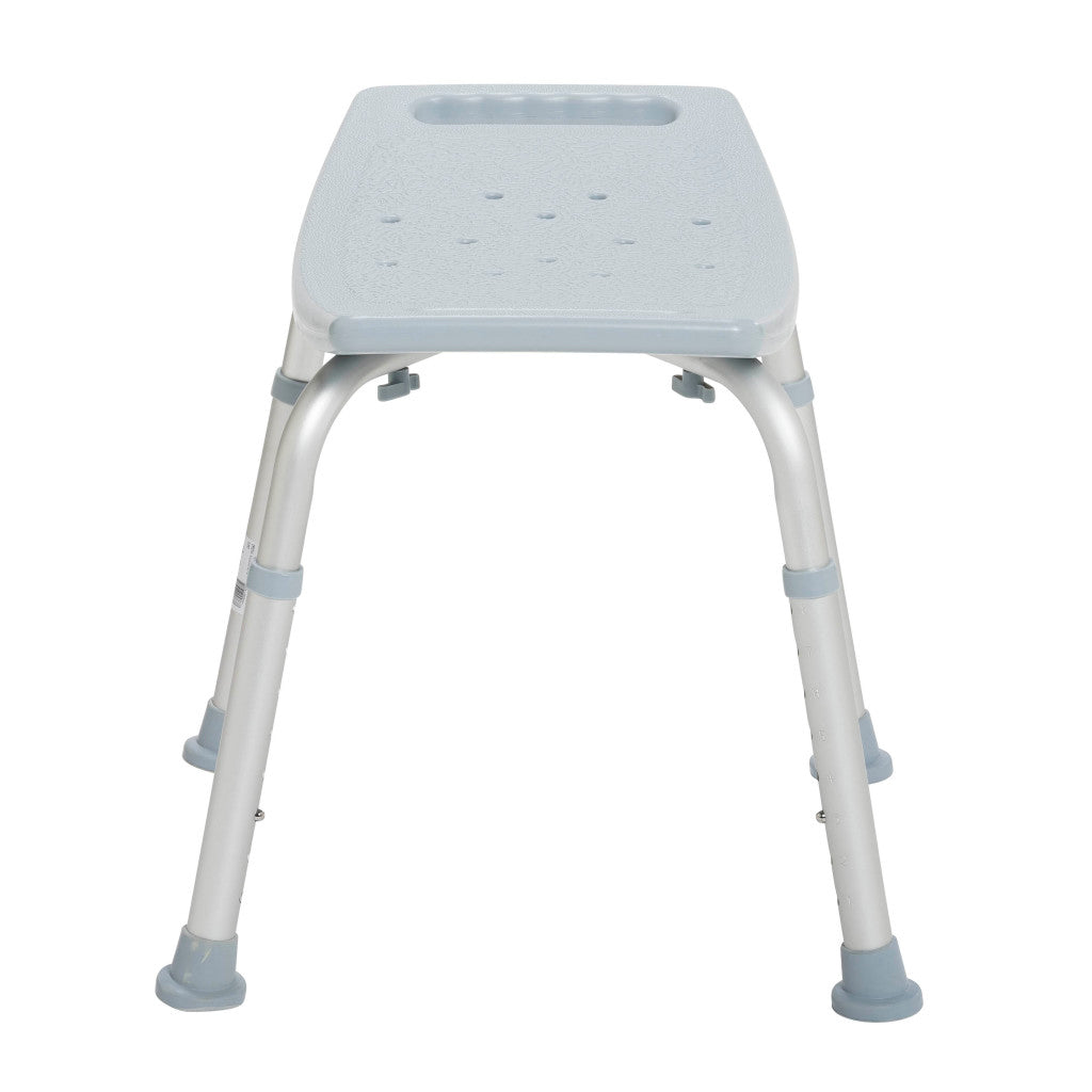 Bathroom safety shower bench with gray plastic seat, drainage holes, tool holder cutout, and adjustable aluminum legs with
