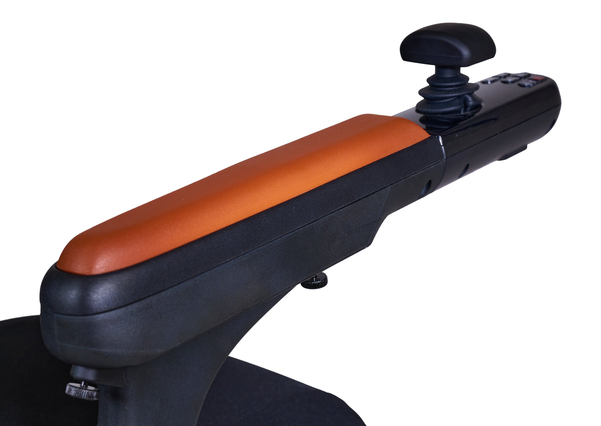 Power wheelchair armrest with orange padded cushion and black joystick controller mounted at the end