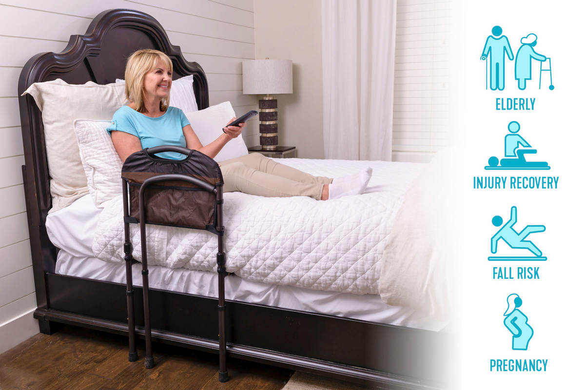 Bed rail with padded handle and storage pouch attached to bedside, shown with woman resting in bed holding a remote control