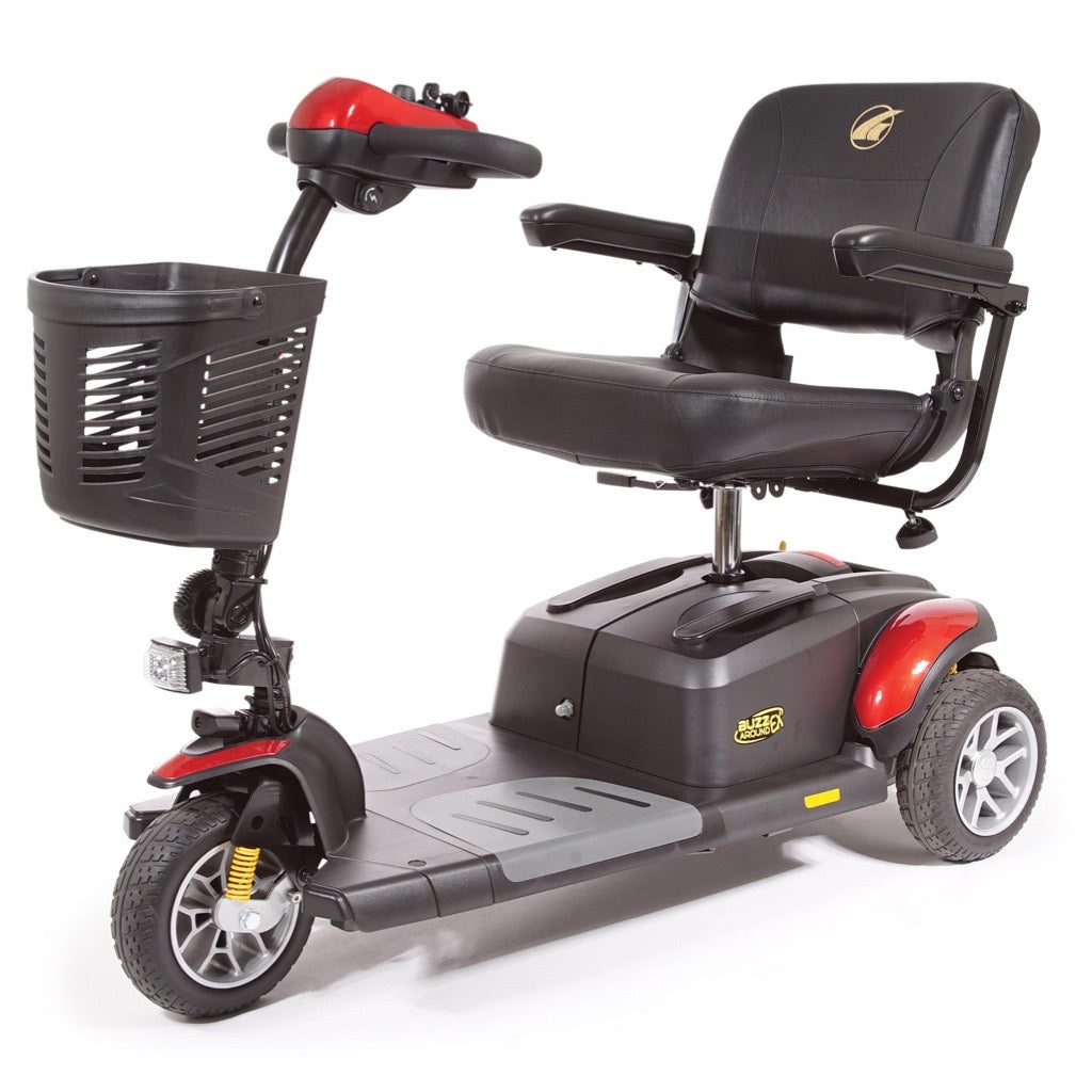 3-wheel electric mobility scooter in red and black with padded seat, armrests, tiller controls, front basket, and headlight