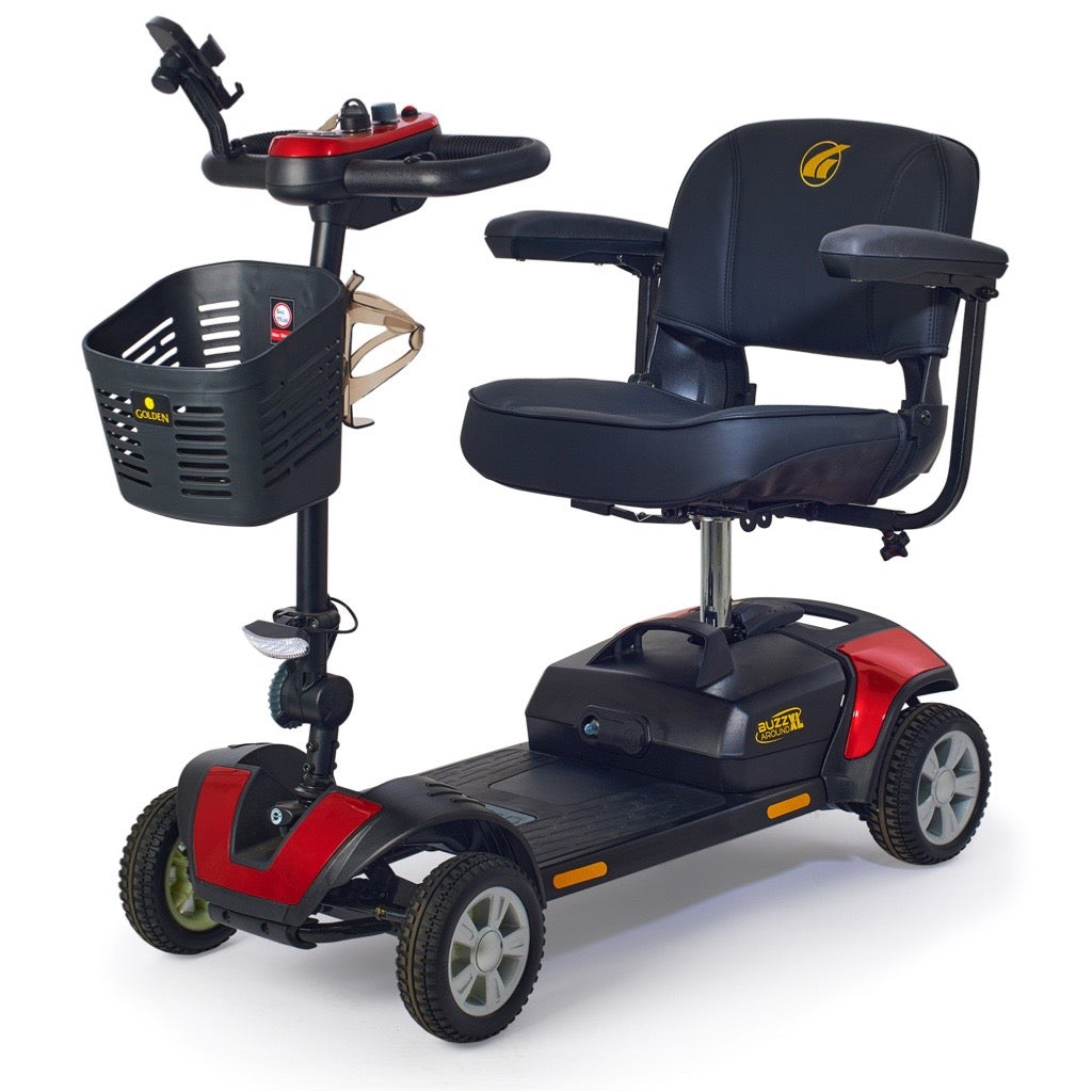 Four-wheel mobility scooter in red and black with padded seat, armrests, tiller controls, and front storage basket