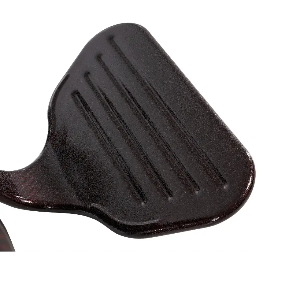 Power wheelchair footrest platform in dark bronze finish with molded grip ridges, shown at an angle against white background