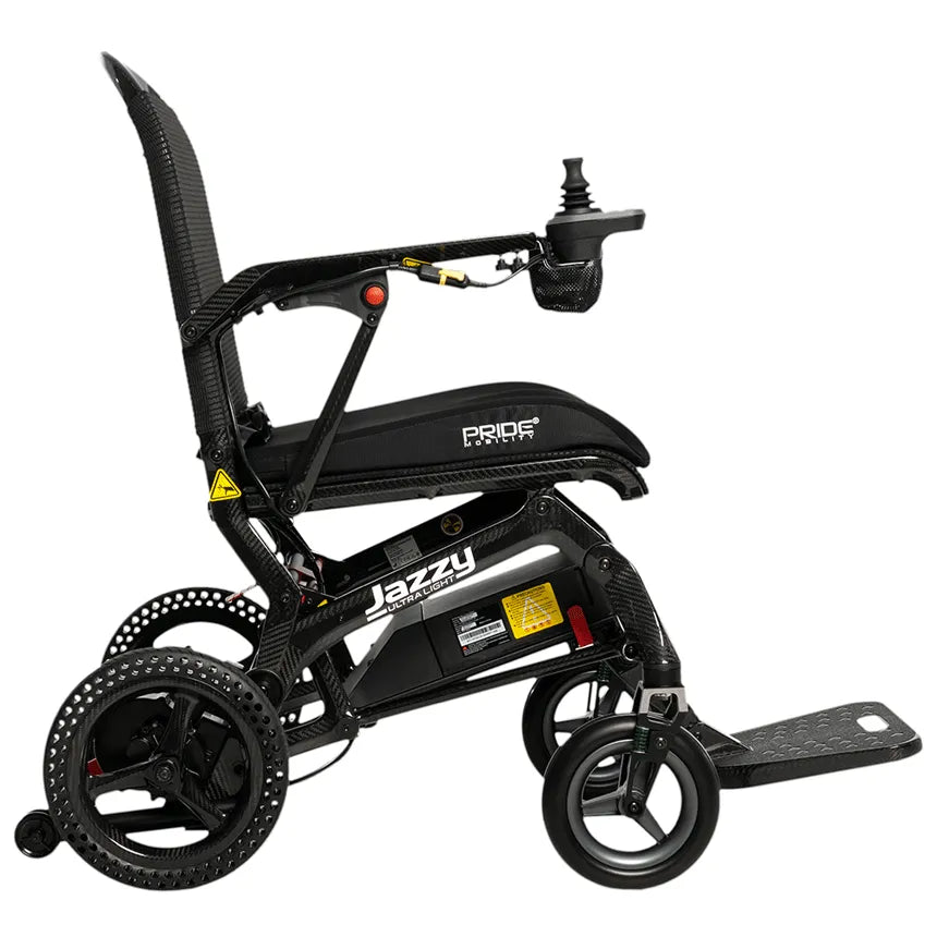 Power wheelchair, Pride Mobility Jazzy Ultra Light, carbon fiber frame with joystick controller, side view on white