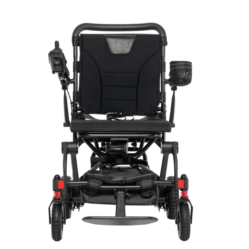 Power wheelchair with black carbon frame, padded seat and back, joystick controller, cup holder, red rear suspension, and