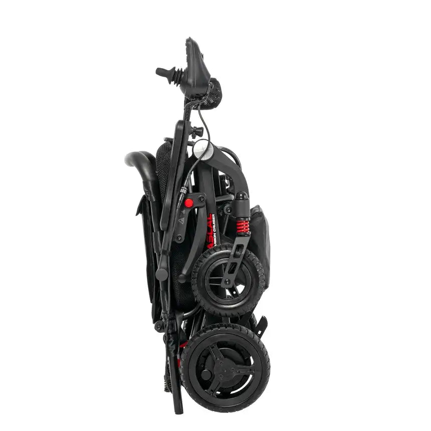 Folding power wheelchair collapsed into compact upright position, showing black frame, red suspension springs, and joystick