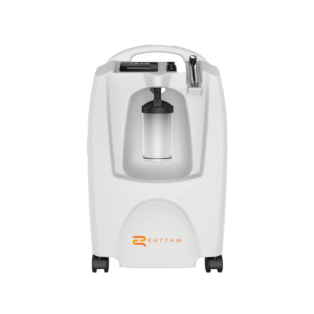 Rhythm stationary oxygen concentrator in white with carry handle, front-mounted humidifier bottle, flow meter, and rolling