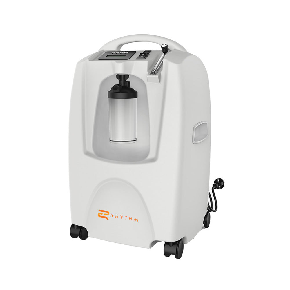 Rhythm stationary oxygen concentrator in white with carry handle, humidifier bottle, flow meter, digital display, and