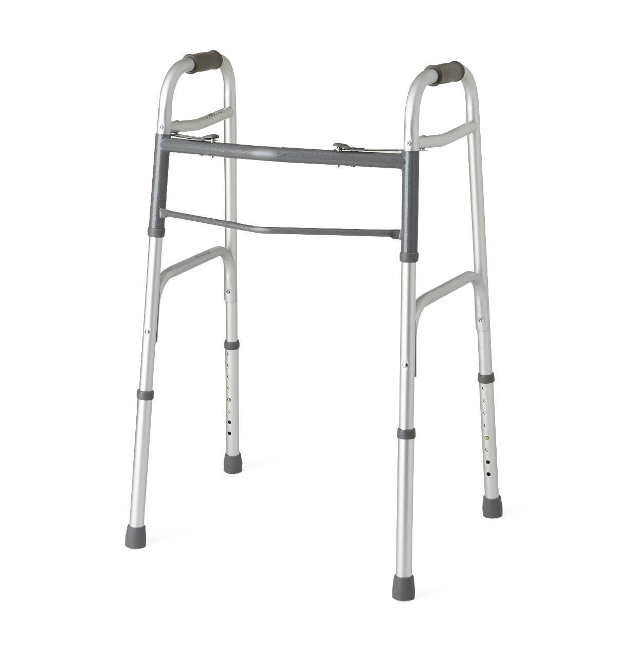 Folding walker with silver aluminum frame, gray padded handgrips, dual push-button release, adjustable legs, and rubber tip