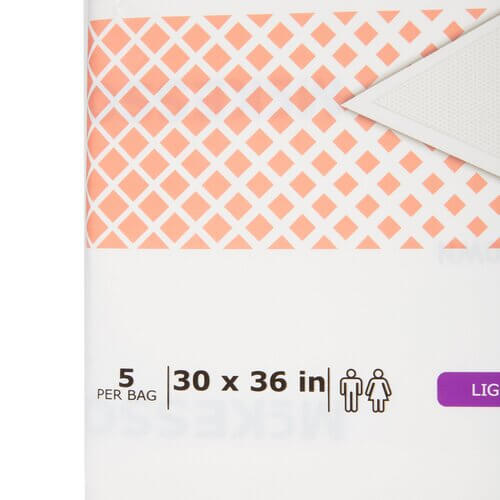 Disposable underpads package with orange diamond pattern, labeled 5 per bag, 30x36 inch size, light absorbency, unisex use