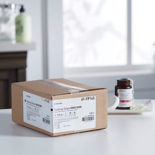 Iodoform wound packing strips in a labeled cardboard box on a white countertop, with a small product bottle visible in the